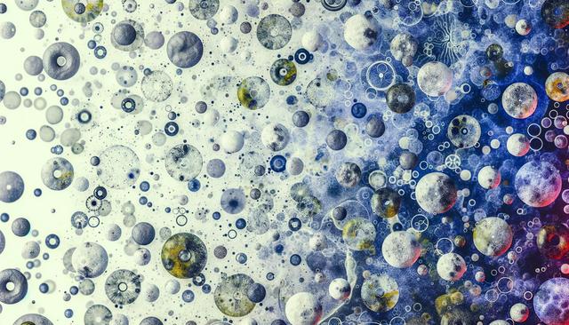 Abstract image with various sized, textured spheres in white, gray, and blue tones, creating a cosmic effect.